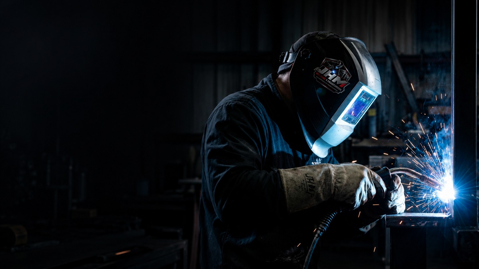Welder working on a custom steel fabrication project